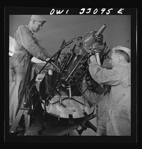 Bar Harbor, Maine. Civil Air Patrol base headquarters of coastal patrol no. 20. Plane engine receiving a routine overhaul in the hangar