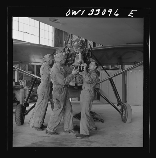 Bar Harbor, Maine. Civil Air Patrol base headquarters of coastal patrol no. 20. Replacing the cylinders in a plane after overhauling it