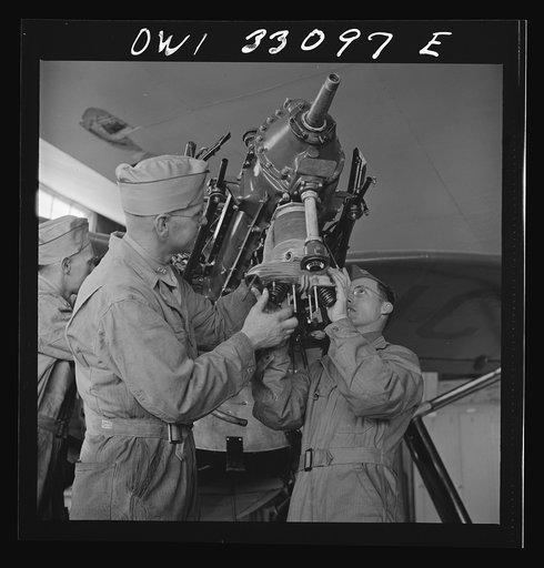 Bar Harbor, Maine. Civil Air Patrol base headquarters of coastal patrol no. 20. Replacing the cylinders in a plane after overhauling it