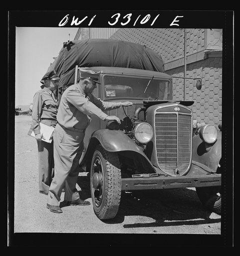 Bar Harbor, Maine. Civil Air Patrol base headquarters of coastal patrol no. 20. Major James B. King, base commander, on a routine inspection of all installations and equipment