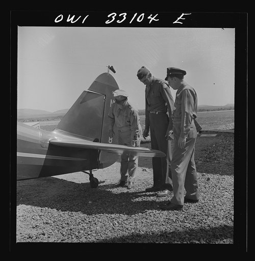 Bar Harbor, Maine. Civil Air Patrol base headquarters of coastal patrol no. 20. Major James B. King, base commander, on a routine inspection of all installations and equipment