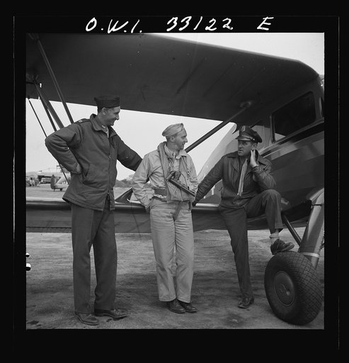 Untitled photo, possibly related to: Bar Harbor, Maine. Civil Air Patrol base headquarters of coastal patrol no. 20. A pilot and an observer after completing a patrol
