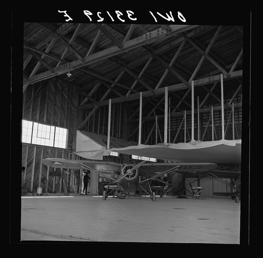 Bar Harbor, Maine. Civil Air Patrol base headquarters of coastal patrol no. 20. The false ceiling in the background of the hangar covered with canvas is for heating up the planes in winter
