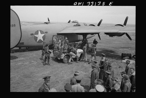 Bomber crews of the U.S. Army 9th Air Force are being given a chalk talk by Major Frank W. Delong, squadron commander, before they take off on a mission over Axis territory. These are the heavy bomber groups who are disrupting Axis shipping in the Meditarranean, thus hastening the defeat of the rema