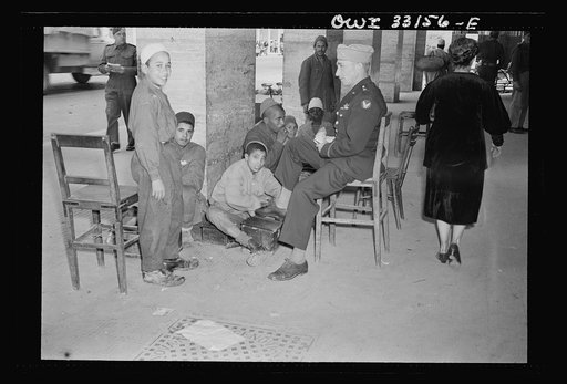 Tripoli, Libya. Brigadier General Auby C. Strickland of the U.S. Army 9th Air Force getting his shoes shined