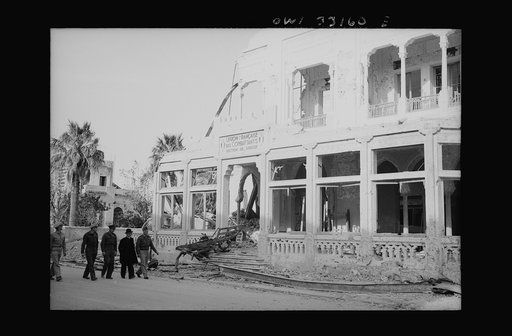 Sousse, Tunisia. Archbishop Spellman walking with American officers through the streets of Sousse
