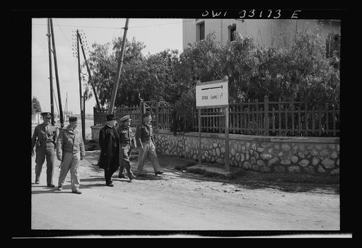 Sfax, Tunisia. Archbishop Spellman walking with American officers in the vicinity of the railway station
