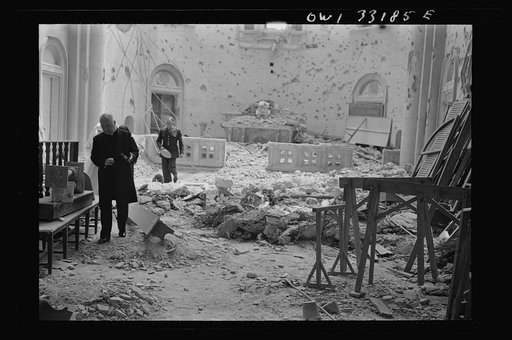 Tripoli, Libya. Archbishop Spellman of New York (foreground) inspecting the damage done to the chapel of the Franciscan Missionaries of Mary