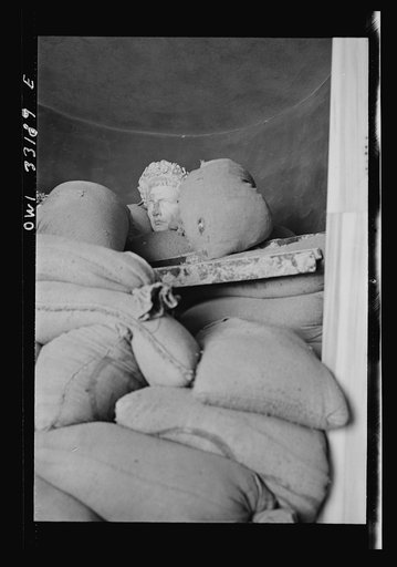 Tripoli, Libya. A Roman head among sandbags