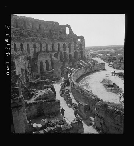 American troops of the 57th Fighter Group sightseeing among Roman ruins in Tunisia