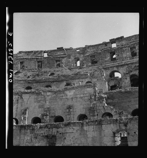 American troops of the 57th Fighter Group sightseeing among Roman ruins in Tunisia