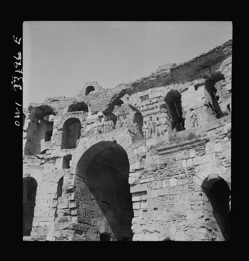 American troops of the 57th Fighter Group sightseeing among Roman ruins in Tunisia