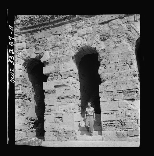 American troops of the 57th Fighter Group sightseeing among Roman ruins in Tunisia