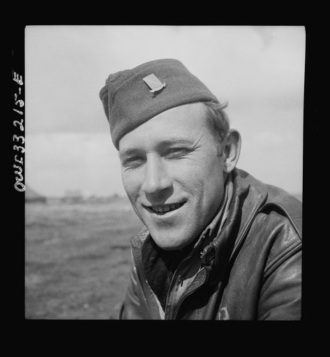 Technical Sergeant Kermit M. Gregory, radio operator of the Snow White, a B-24 bomber of the U.S. Army 9th Air Force in Tunisia. He is one of the original crew members that brought this bomber across the Atlantic and then completed thirty-six missions over enemy targets, piling up 300 hours of comba