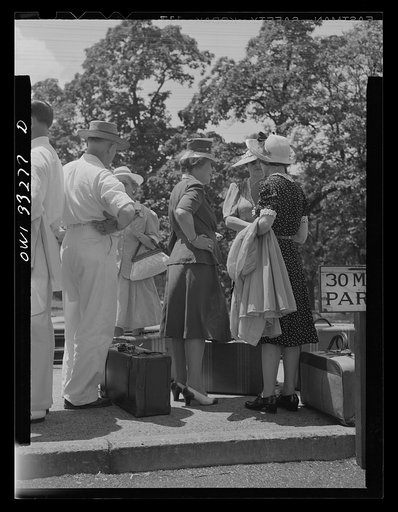 Untitled photo, possibly related to: Silver Spring, Maryland. People waiting for a train at the railroad station