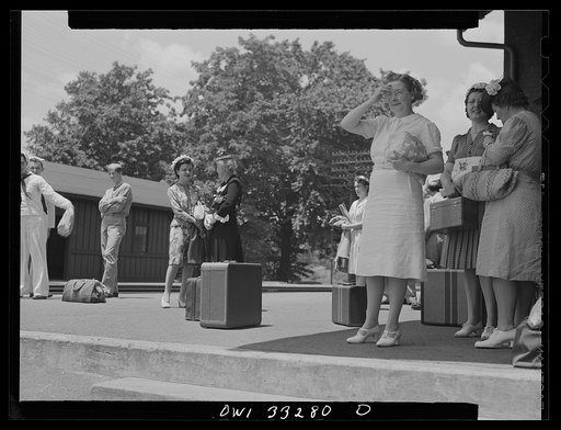 Untitled photo, possibly related to: Silver Spring, Maryland. People waiting for a train at the railroad station