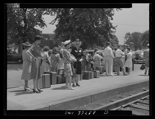 Untitled photo, possibly related to: Silver Spring, Maryland. People waiting for a train at the railroad station
