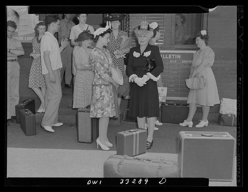 Untitled photo, possibly related to: Silver Spring, Maryland. People waiting for a train at the railroad station