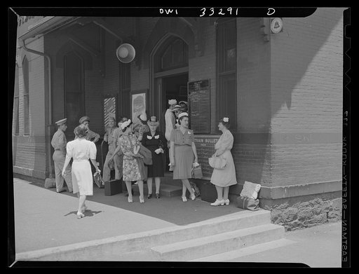 Untitled photo, possibly related to: Silver Spring, Maryland. People waiting for a train at the railroad station