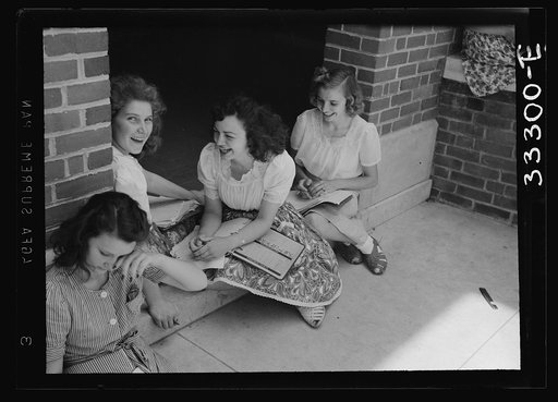 Randolph Henry High School. Keysville, Virginia. Girls talking and studying at the school entrance