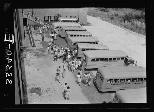 Untitled photo, possibly related to: Keysville, Virginia. Randolph Henry High School. Buses bring students from miles around as the school covers an area of 496 square miles. Some children come as far as thirty miles to school in one of the seventeen buses, some of whcih are driven by seniors