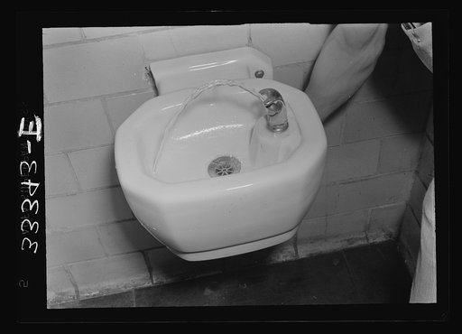 Untitled photo, possibly related to: Keysville, Virginia. Randolph Henry High School. Boy at the drinking fountain