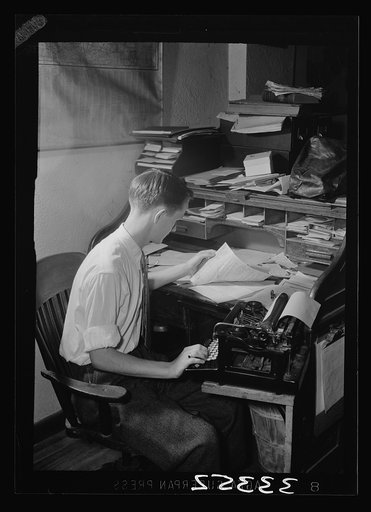 Keysville, Virginia. Randolph Henry High School. A student who runs a garage at night with his brother. Here he is seen working on his accounts