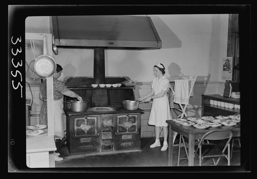 Keysville, Virginia. Randolph Henry High School. Kitchen of cafeteria. Lunches cost about fifteen cents. Students don't have much money and they bring produce from farms and receive tickets