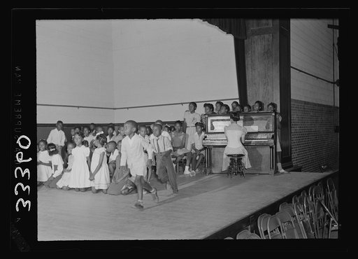 Charlotte Court House, Virginia. Central High School. A combination gym and auditorium where the seats are movable. The elementary school has no auditorium so the children have come over to practice an operetta