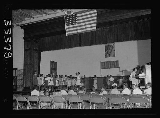 Charlotte Court House, Virginia. Central High School. Combination gym and auditorium where seats are movable. The elementary school has no auditorium so children have come over to practice an operetta