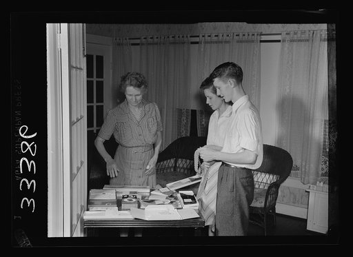 Keysville, Virginia. Randolph Henry High School. Looking over boy's graduation presents