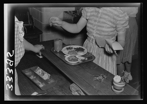 Untitled photo, possibly related to: Keysville, Virginia. Randolph Henry High School. Cafeteria. Students don't have much money so they bring produce from farms for which they receive tickets. Lunches cost about fifteen cents. Typical lunch for fifteen cents: candied yams, macaroni and cheese, fruit
