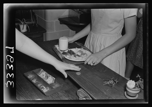 Untitled photo, possibly related to: Keysville, Virginia. Randolph Henry High School. Cafeteria. Students don't have much money so they bring produce from farms for which they receive tickets. Lunches cost about fifteen cents. Typical lunch for fifteen cents: candied yams, macaroni and cheese, fruit