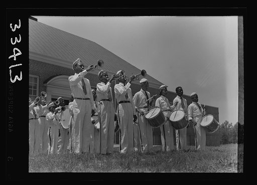 Untitled photo, possibly related to: Charlotte Court House, Virginia. Central High School band every month or so marches up Main Street to give drills and concerts. Players must buy their own instruments and costumes and pay for their own lessons. Lessons are given during school hours