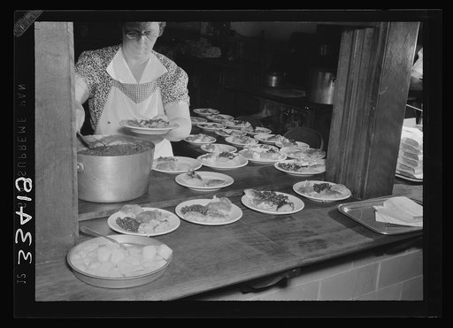 Keysville, Virginia. Randolph Henry High School. Cafeteria. Students don't have much money so they bring produce from farms for which they receive tickets. Lunches cost about fifteen cents. Typical lunch for fifteen cents: candied yams, macaroni and cheese, fruit salad, deviled eggs, dessert and mil