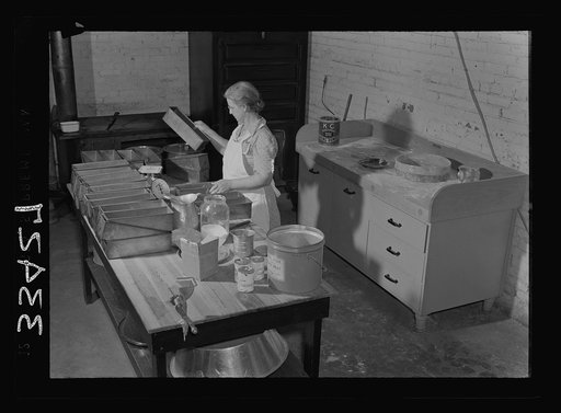 Untitled photo, possibly related to: Keysville, Virginia. Baking bread in central bakery. Seventy-five loaves are baked here each day and sent to schools via school buses