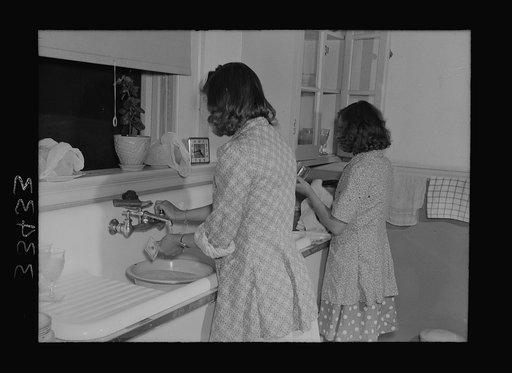 Keysville, Virginia. Randolph Henry High School. Washing dishes after a meal in the home economics cottage