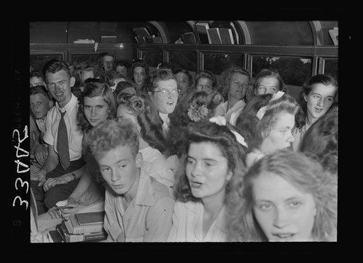Untitled photo, possibly related to: Charlotte County, Virginia. Interior of a school bus. Boy in back is member of safety patrol. One always goes along to keep order in the bus