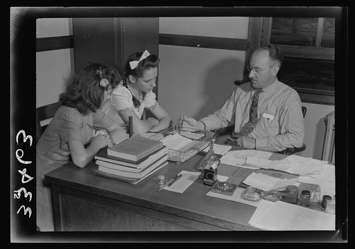 Keysville, Virginia. Randolph Henry High School. Mr. J. M. Garber, principal, working with two students on their next semester's schedules