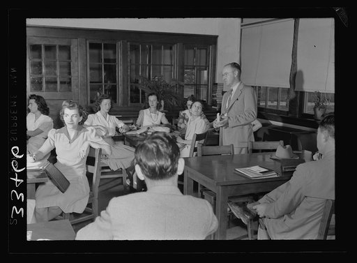 Charlotte County, Virginia. Principal holding ten minutes teachers' meeting before classes in the morning, a regular routine