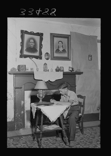Untitled photo, possibly related to: Keysville, Virginia. Randolph Henry High School. One of the students studying at home