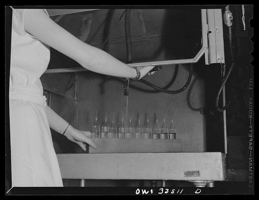 Parke, Davis and Company, manufacturing chemists, Detroit, Michigan. Filling large ampoules by hand