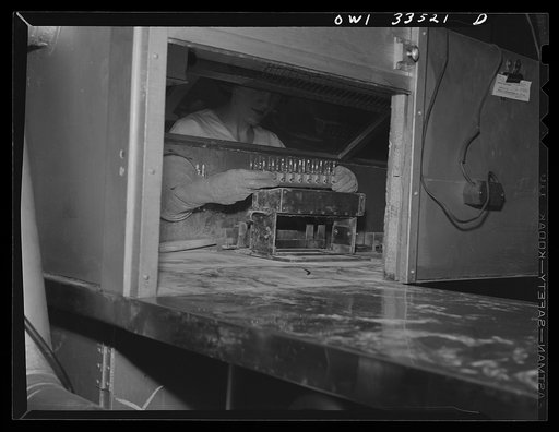 Parke, Davis and Company, manufacturing chemists, Detroit, Michigan. Filling ampoules with an arsenical drug in powder form under protected conditions