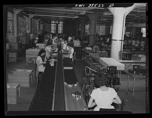 Parke, Davis and Company, manufacturing chemists, Detroit, Michigan. Packaging of pills and tablets on a conveyor belt