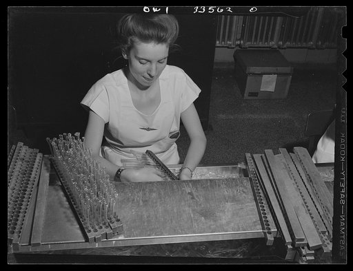 Parke, Davis and Company, manufacturing chemists, Detroit, Michigan. Cutting tips off empty capsules