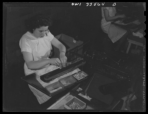 Untitled photo, possibly related to: Parke, Davis and Company, manufacturing chemists, Detroit, Michigan. Filling ampoules with medicinal solution