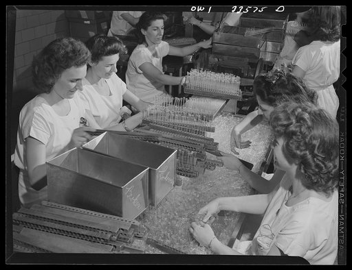 Parke, Davis and Company, manufacturing chemists, Detroit, Michigan. Inspecting empty ampoules