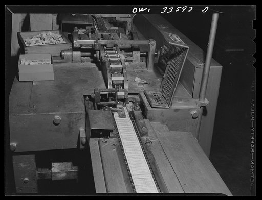 Parke, Davis and Company, manufacturing chemists, Detroit, Michigan. Automatic cartoning machine used in ampoule manufacture