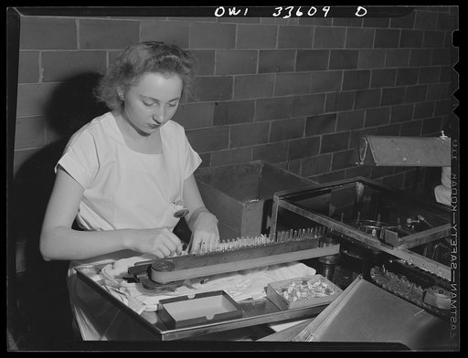 Parke, Davis and Company, manufacturing chemists, Detroit, Michigan. An automatic labeling machine