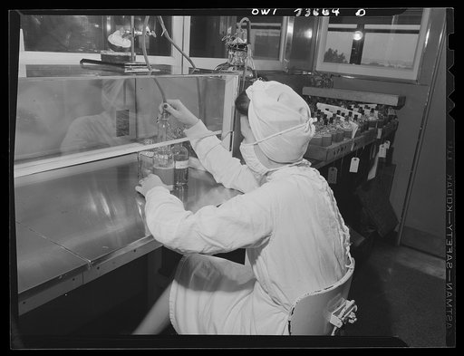 Parke, Davis and Company, manufacturing chemists, Detroit, Michigan. Siphoning blood plasma into glass containers